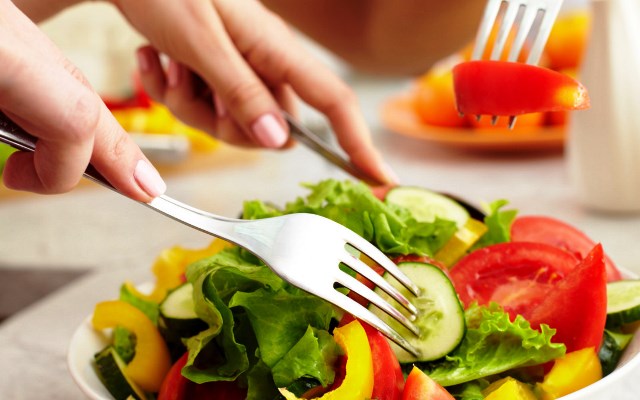 Close-up of human hands with forks tasting salad; Shutterstock ID 82023532; PO: aol; Job: production; Client: drone