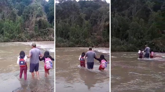 Dos hermanas deben cruzar a pie un río en Brasil para poder llegar a la escuela